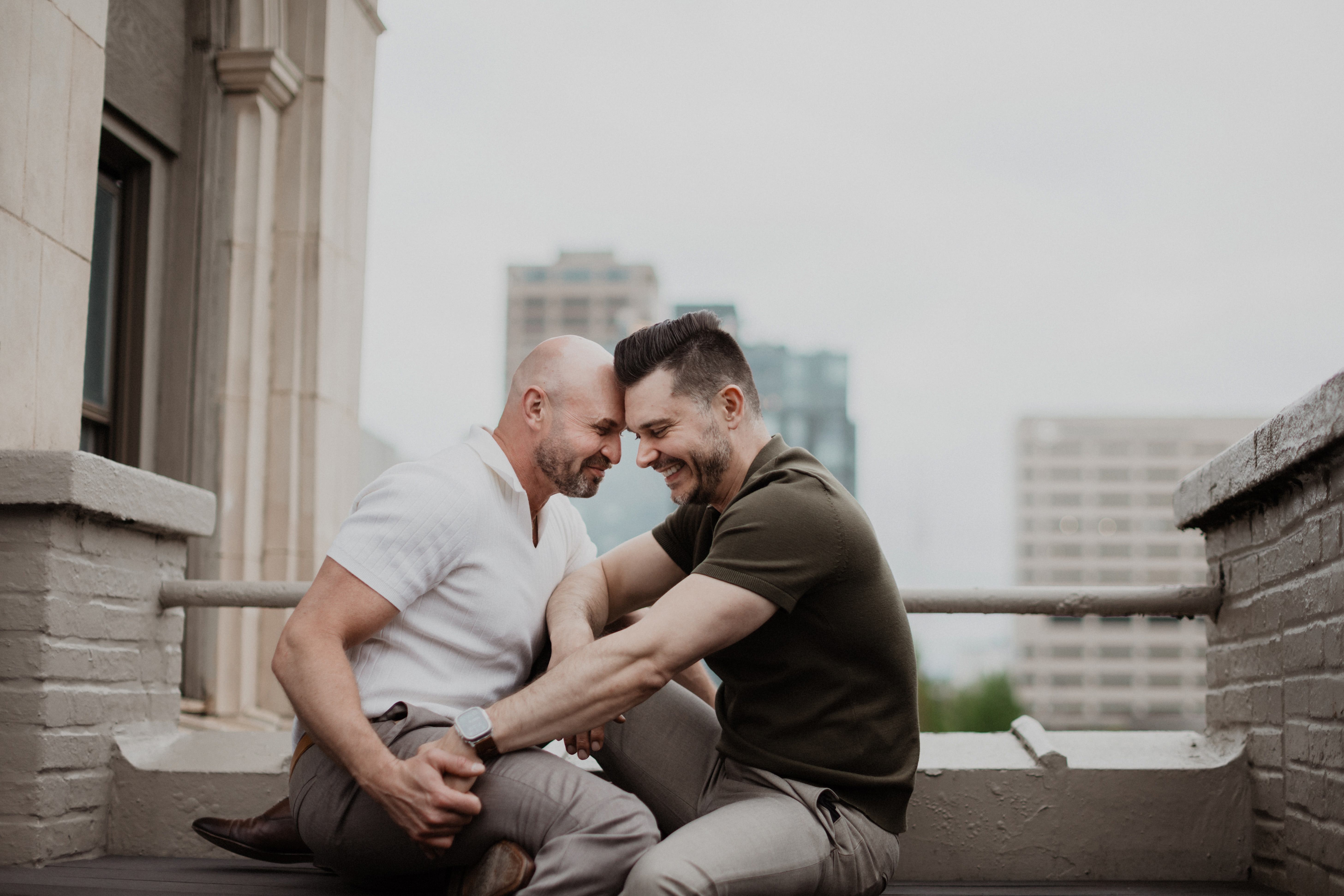 Mark and Jeremy on a rooftop bench