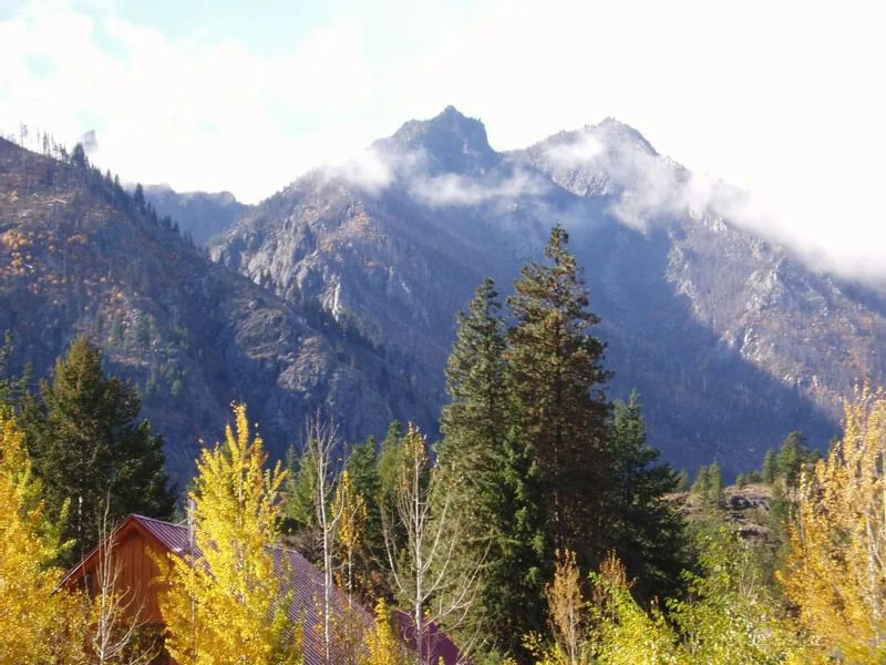 The Sleeping Lady Mountain Resort in winter — cabins and snowy pines